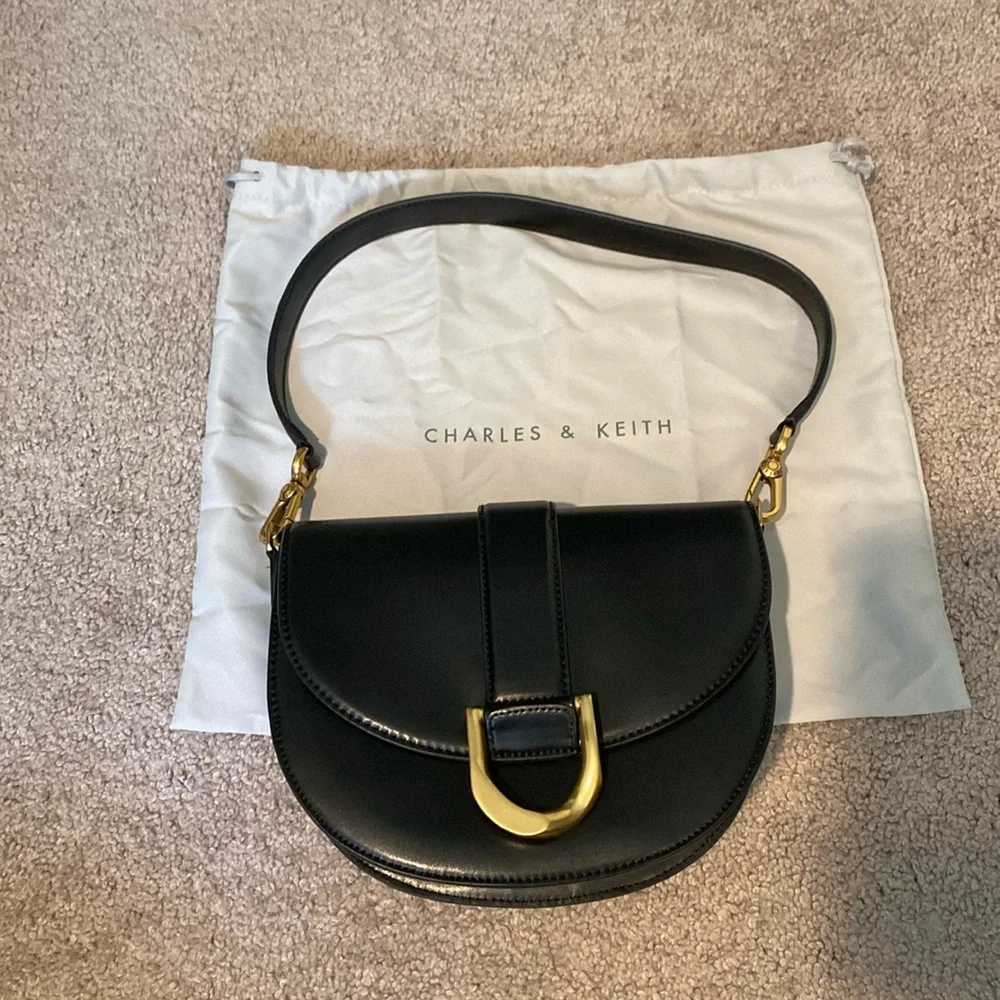 Charles & Keith Black Saddle Shoulder Bag with Gold Accent